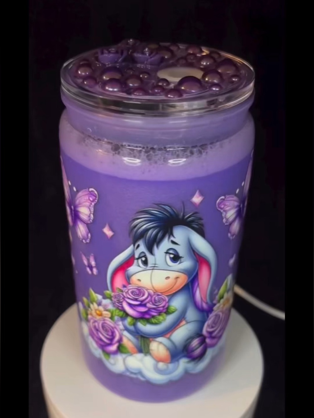 Purple Eeyore-Themed Decorative Tumbler.